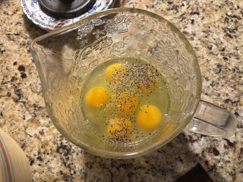 Eggs seasoned with salt and pepper 